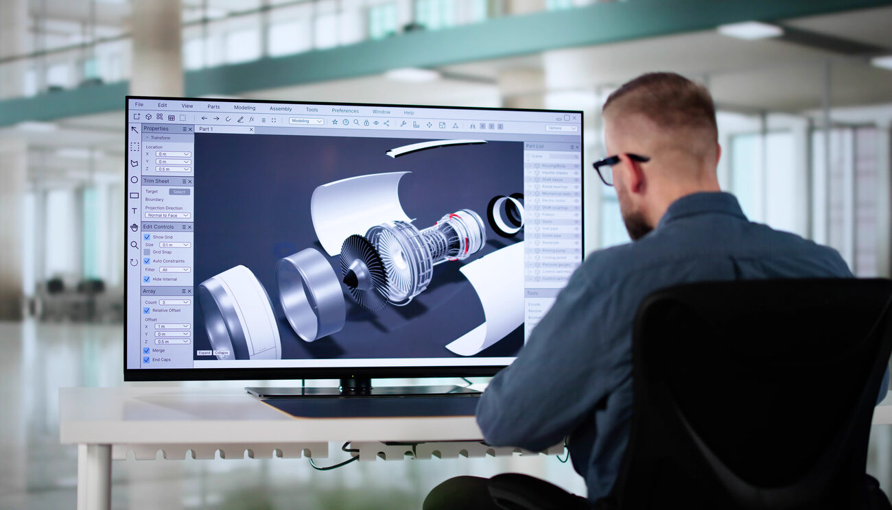 male engineer developing mechanical parts using 3d cad software on laptop